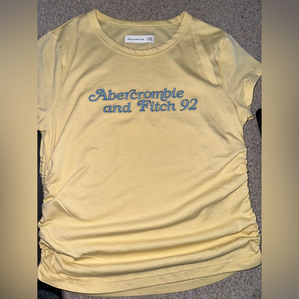 NWOT Girl’s Abercrombie Kids yellow cinched sides t Shirt size 15/16